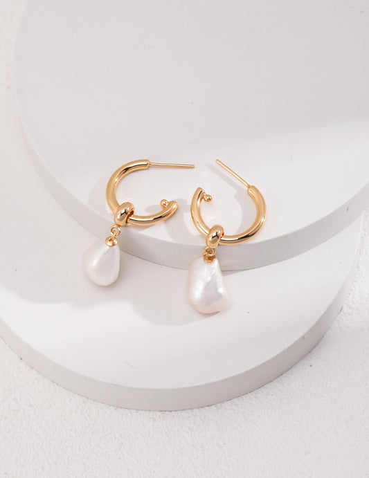 Two-piece sterling silver shaped baroque pearl earrings.